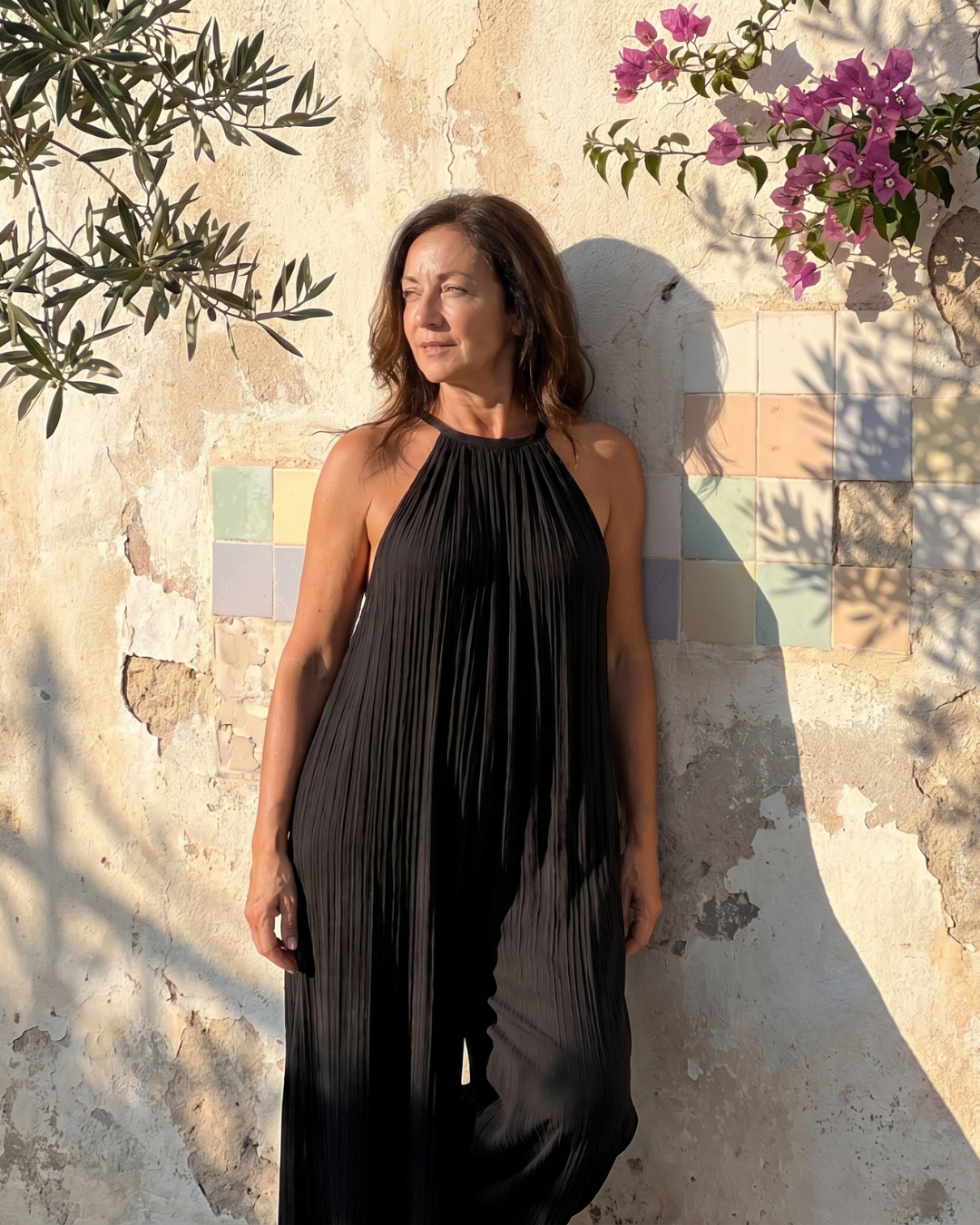 Sylvara | Geplooide halter jumpsuit met wijde pijpen