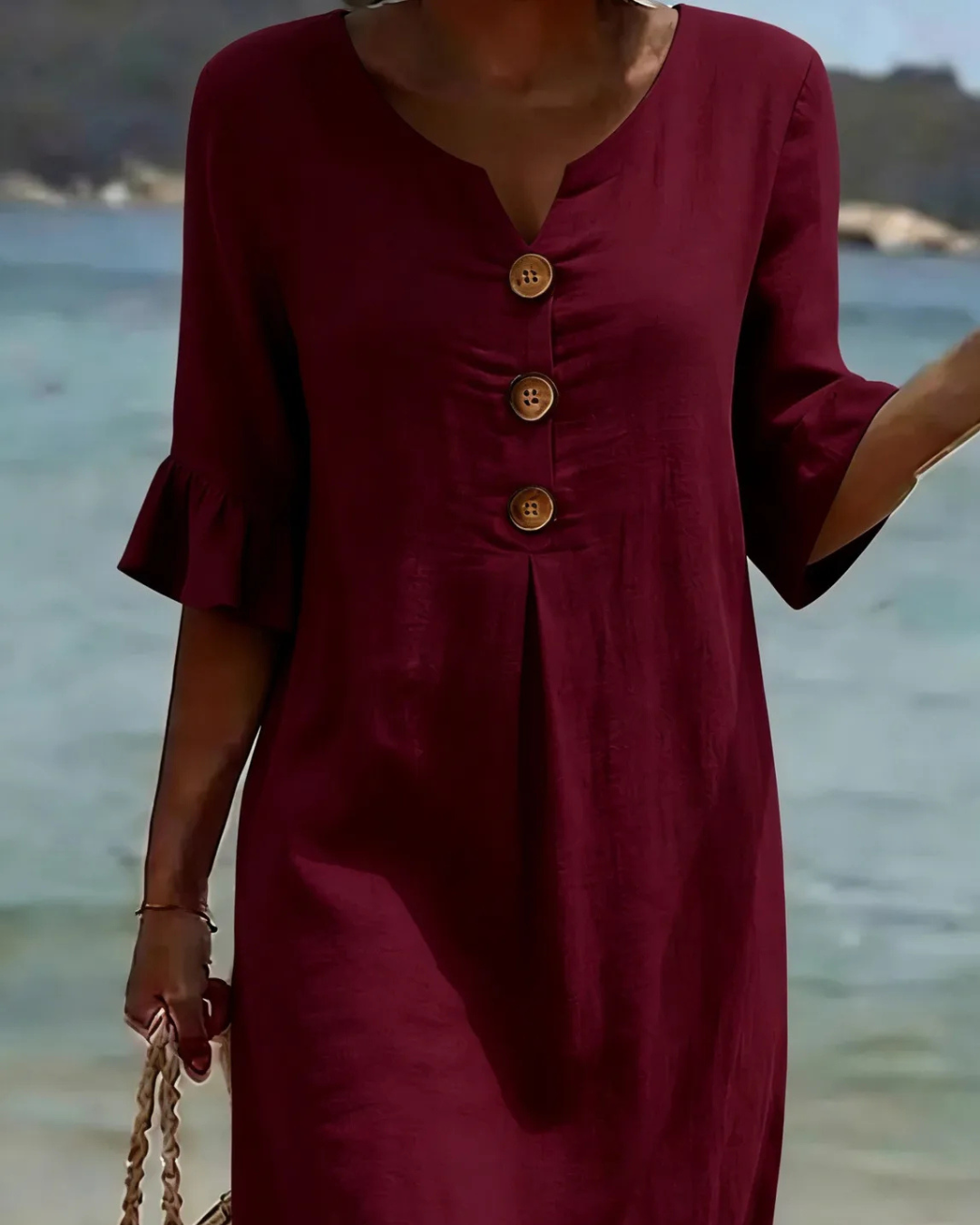 Midi-jurk met V-hals en knoopdetail