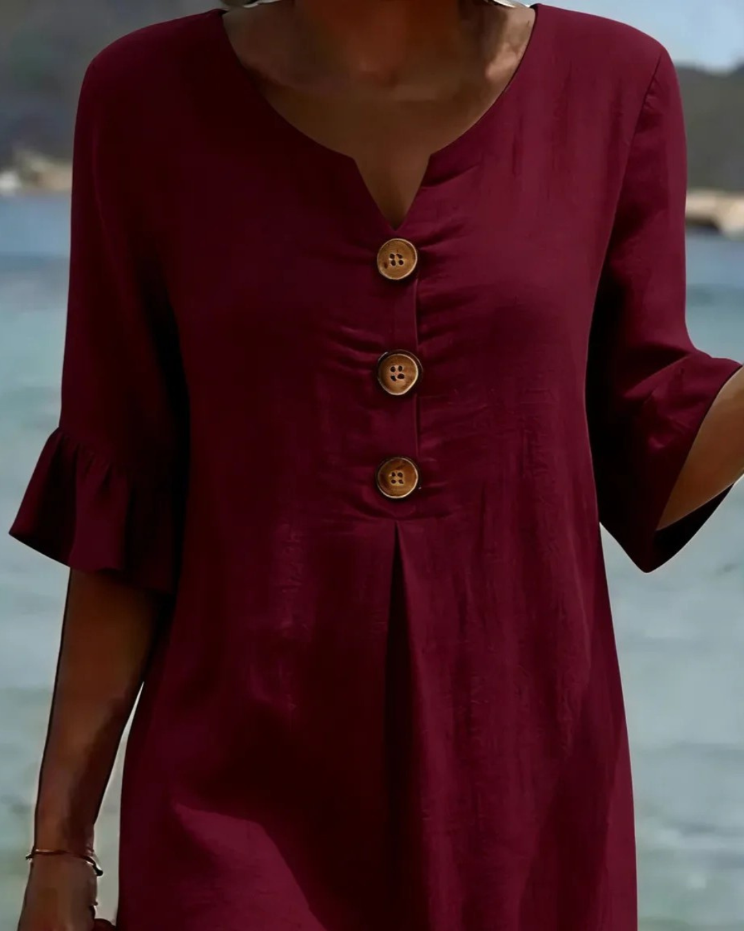 Midi-jurk met V-hals en knoopdetail