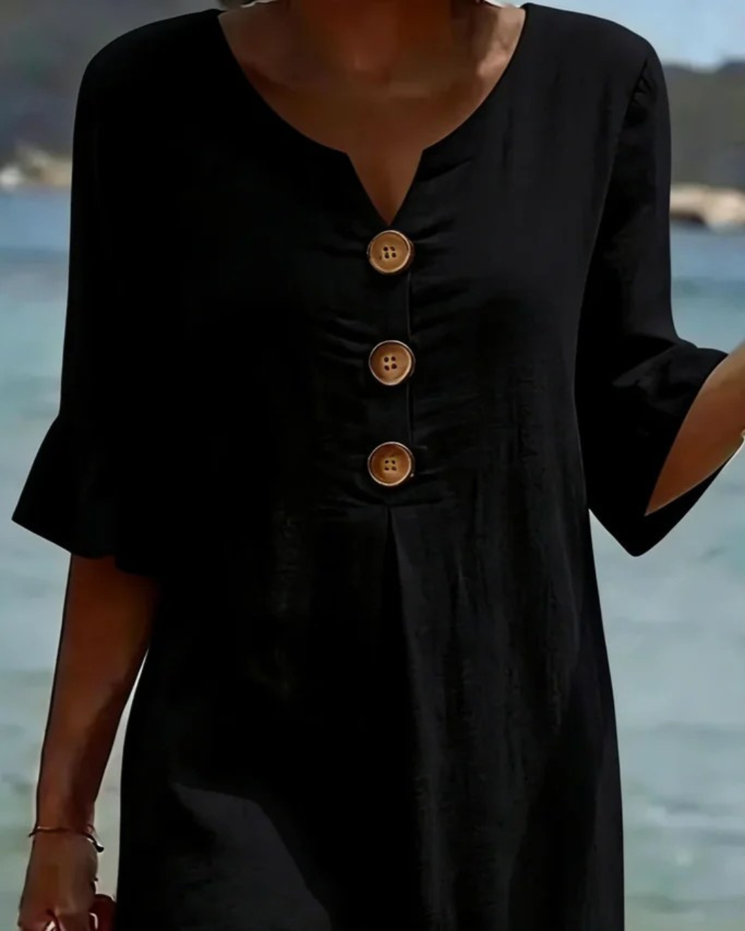 Midi-jurk met V-hals en knoopdetail