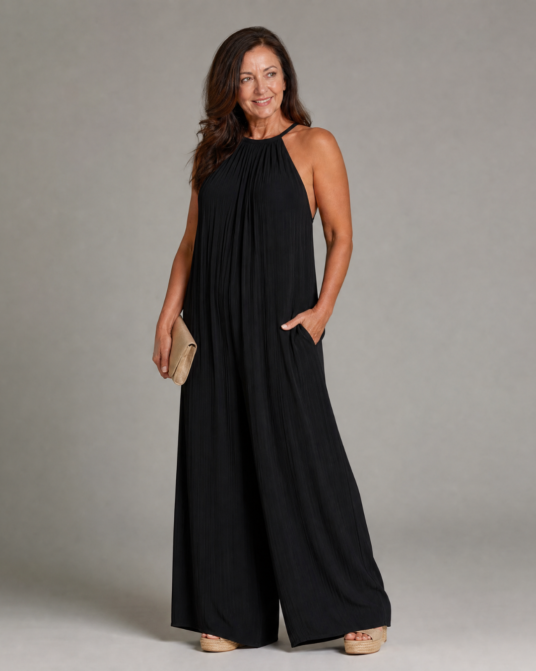 Sylvara | Geplooide halter jumpsuit met wijde pijpen