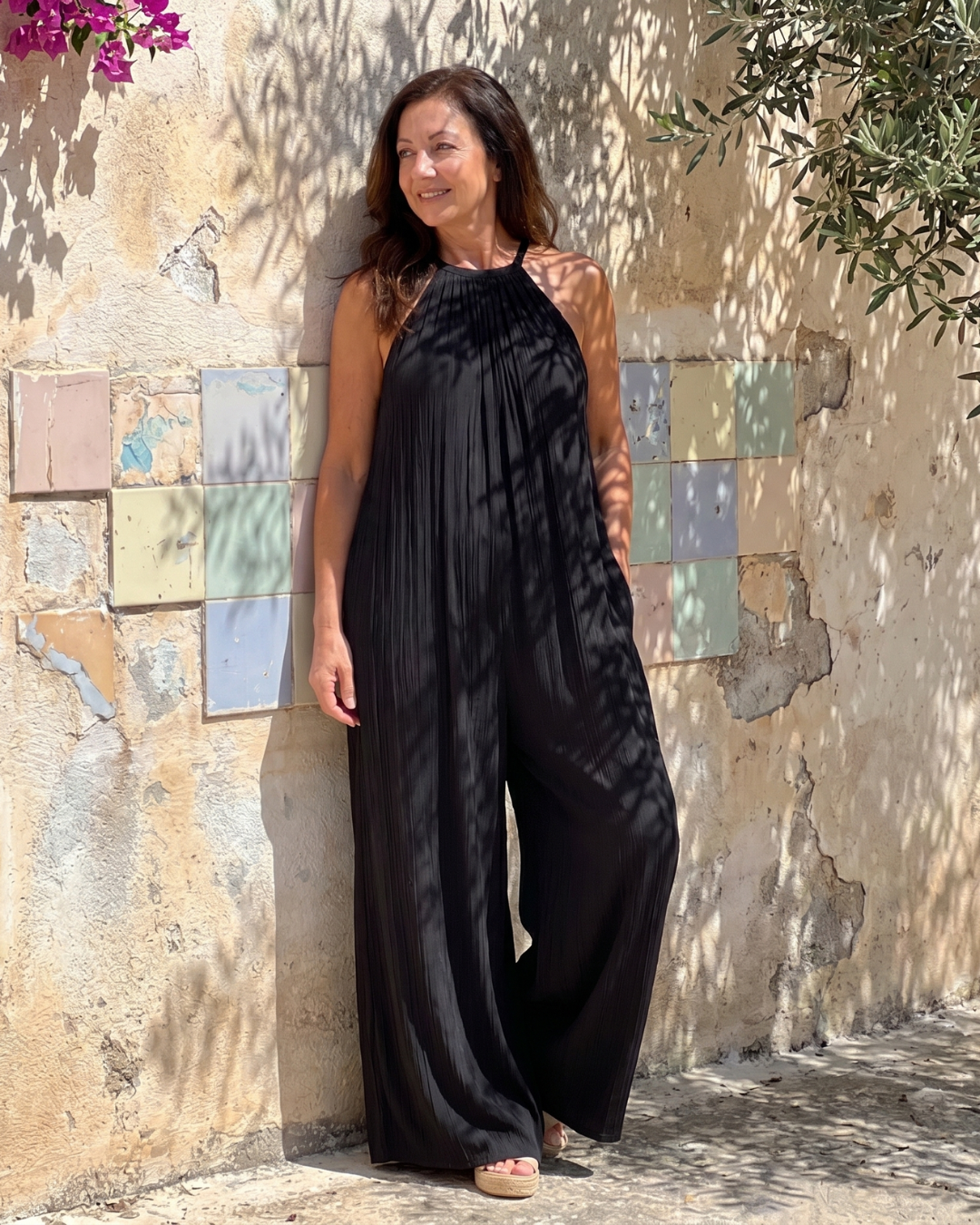 Sylvara | Geplooide halter jumpsuit met wijde pijpen