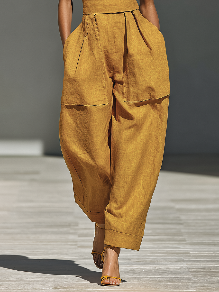 Gabrielle | Mouwloze jumpsuit met gekruiste halslijn en wijde pijpen