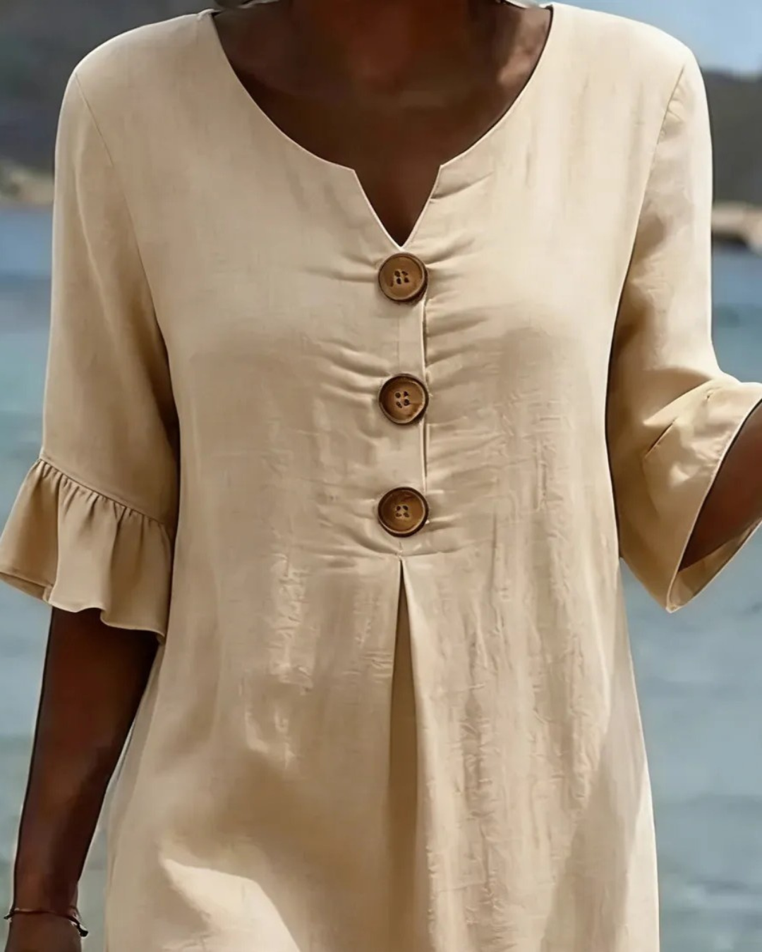 Midi-jurk met V-hals en knoopdetail