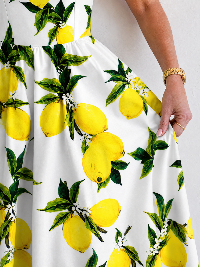Limonelle | Mouwloze midi-jurk met citroenprint