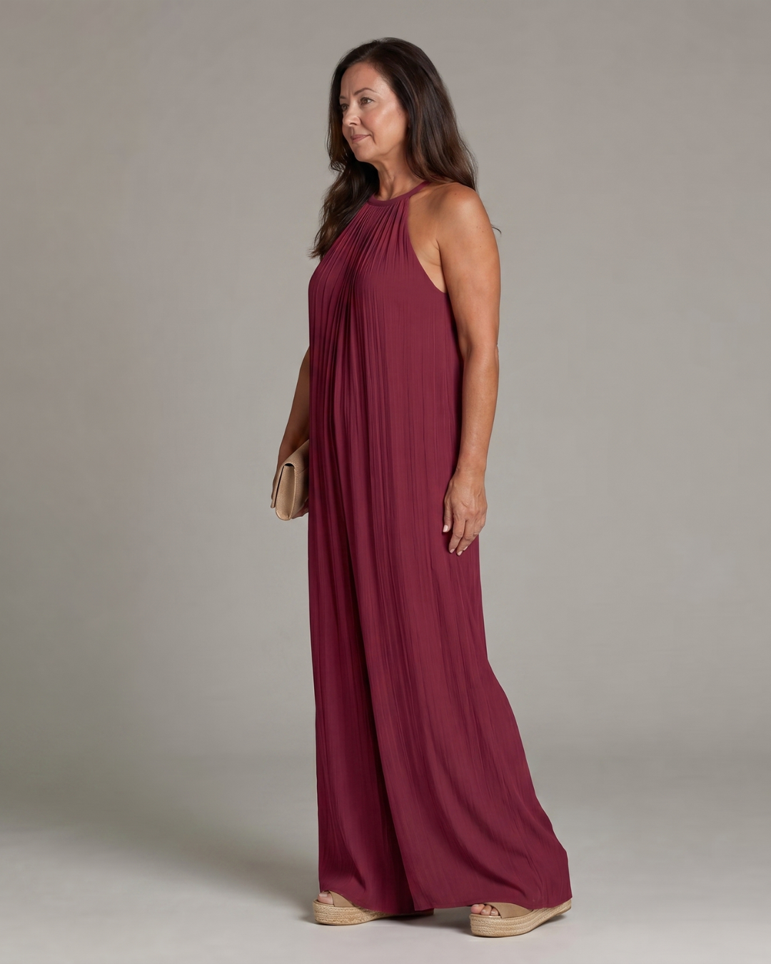 Sylvara | Geplooide halter jumpsuit met wijde pijpen