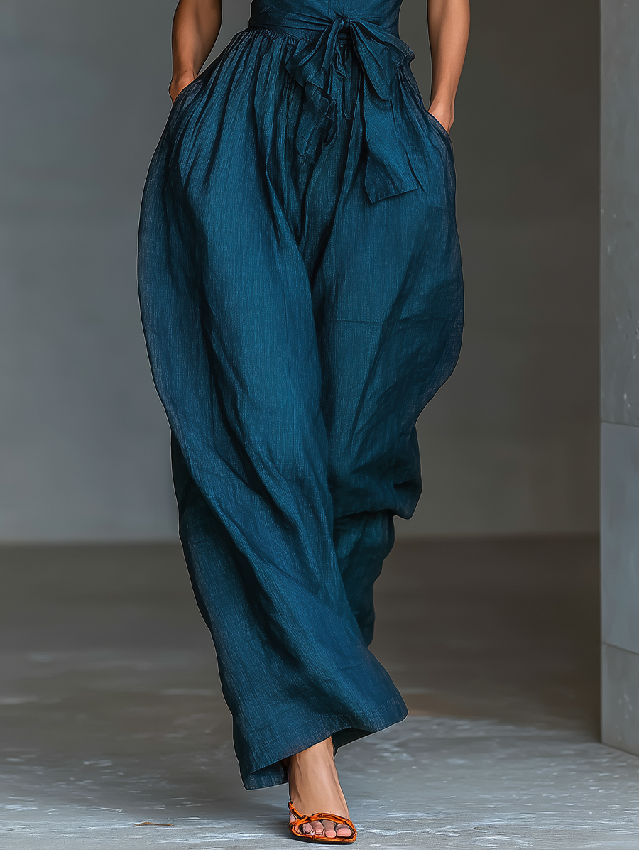 Solène | Jumpsuit met gekruiste schouderbanden en strikceintuur