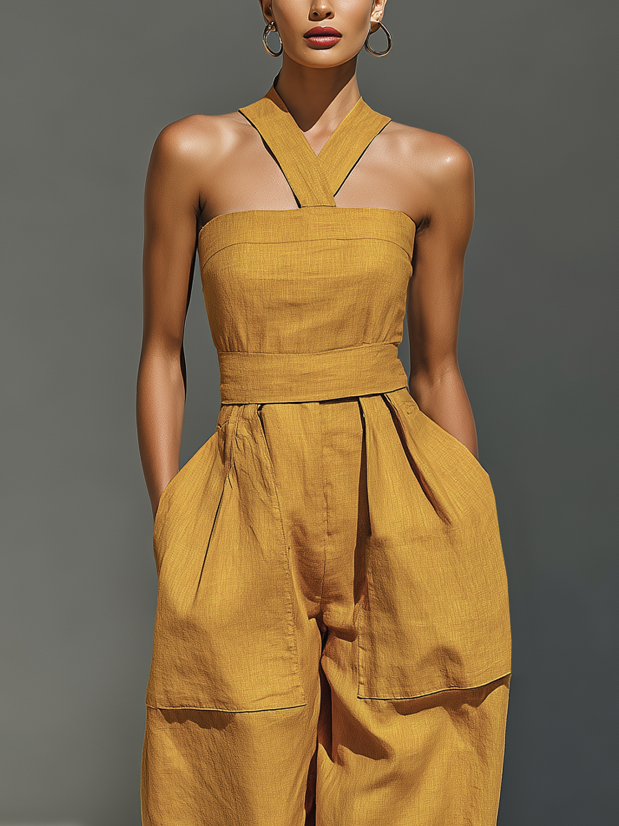 Gabrielle | Mouwloze jumpsuit met gekruiste halslijn en wijde pijpen